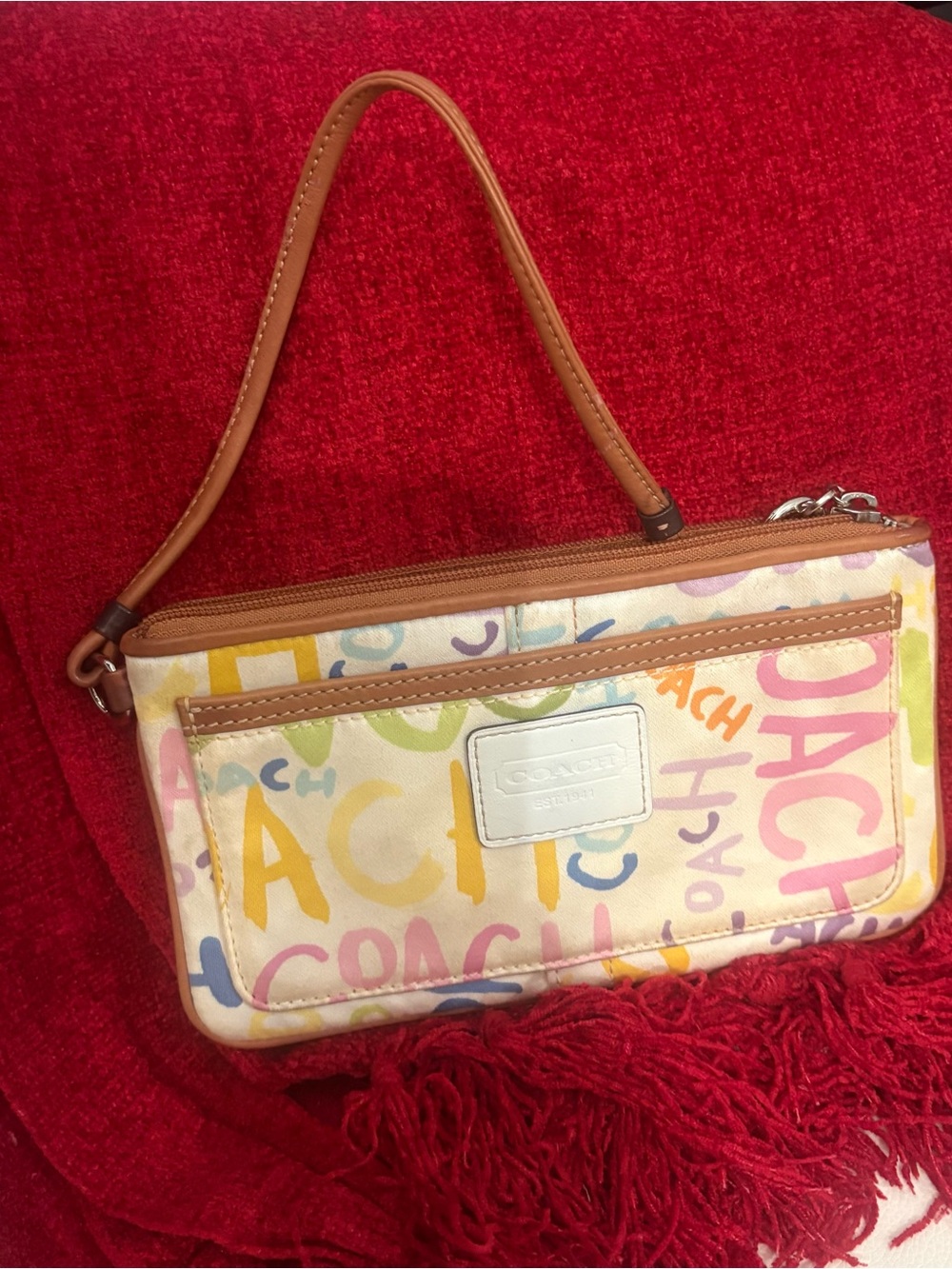 # 38b Coach Multicolor Logo Graffiti Wristlet with Tan Strap
